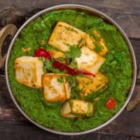 Indian Punjabi cuisine Palak paneer made up of spinach and cottage cheese decorative in kadhai